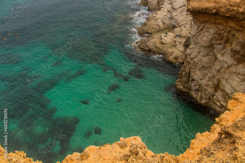 Rock-Studded Beach Beneath a Cliff in Tunisia