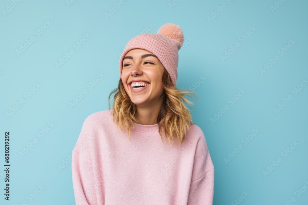 Portrait of a happy woman in her 20s donning a warm wool beanie against a pastel or soft colors background. AI Generation Portrait of a happy woman in her 20s donning a warm wool beanie against a pastel or soft colors background. AI Generation