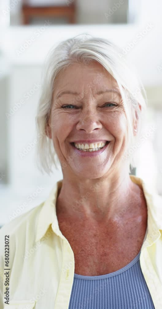 Happy caucasian senior woman standing and laughing in sunny room, slow motion Happy caucasian senior woman standing and laughing in sunny room, slow motion