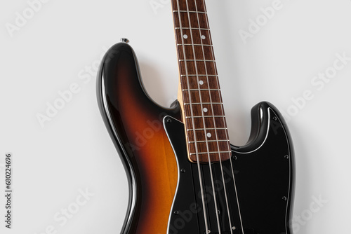 Black bass guitar on white background. Music instrument