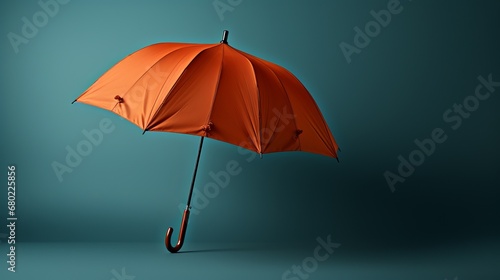 Orange umbrella on a plain background. Banner with copy space. Concept: weather conditions, rain protection