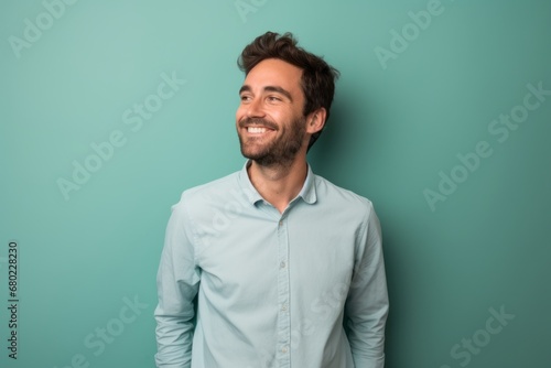Portrait of a cheerful man in his 30s donning a classy polo shirt against a solid pastel color wall. AI Generation