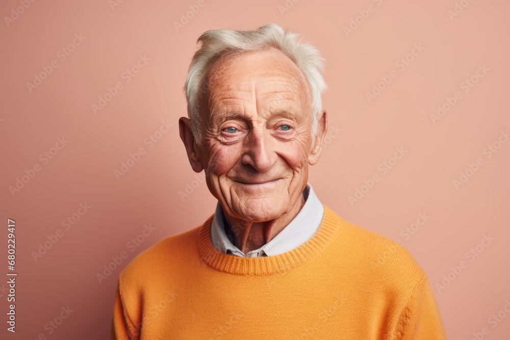 Portrait of a grinning man in his 80s dressed in a warm wool sweater against a solid pastel color wall. AI Generation Portrait of a grinning man in his 80s dressed in a warm wool sweater against a solid pastel color wall. AI Generation