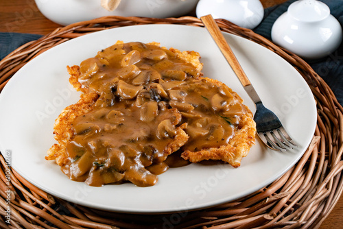 Fototapeta Naklejka Na Ścianę i Meble -  Sauerkraut pancakes /fuczka/ with mushroom sauce .