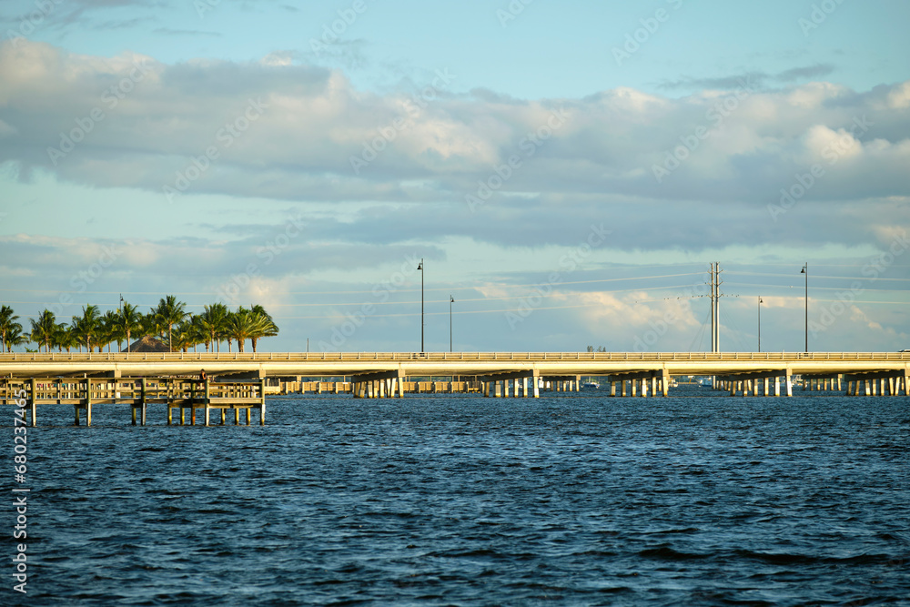 Obraz premium Barron Collier Bridge and Gilchrist Bridge in Florida with moving traffic. Transportation infrastructure in Charlotte County connecting Punta Gorda and Port Charlotte over Peace River