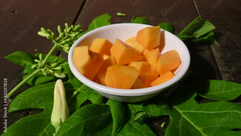 Ripe papaya sliced on bowl. Fresh yellow papaya. It is complete food for humans. Many vitamins are found in it. It is found almost all over the world.
Ripe papaya sliced on bowl. Fresh yellow papaya. It is complete food for humans. Many vitamins are found in it. It is found almost all over the world.