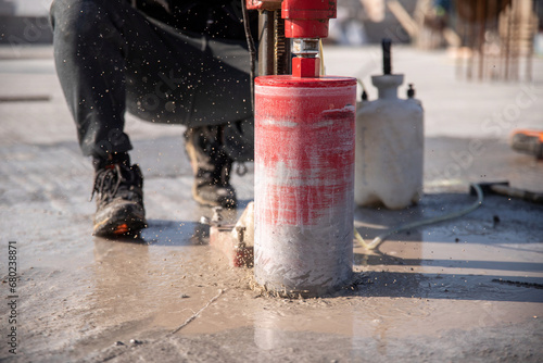 Drilling concrete using a diamond bit drilling rig.