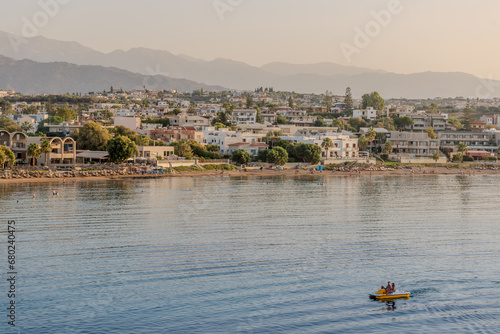 Cityscape at sunset, Agioi Apostoli, Chania, Crete, Greece. photo