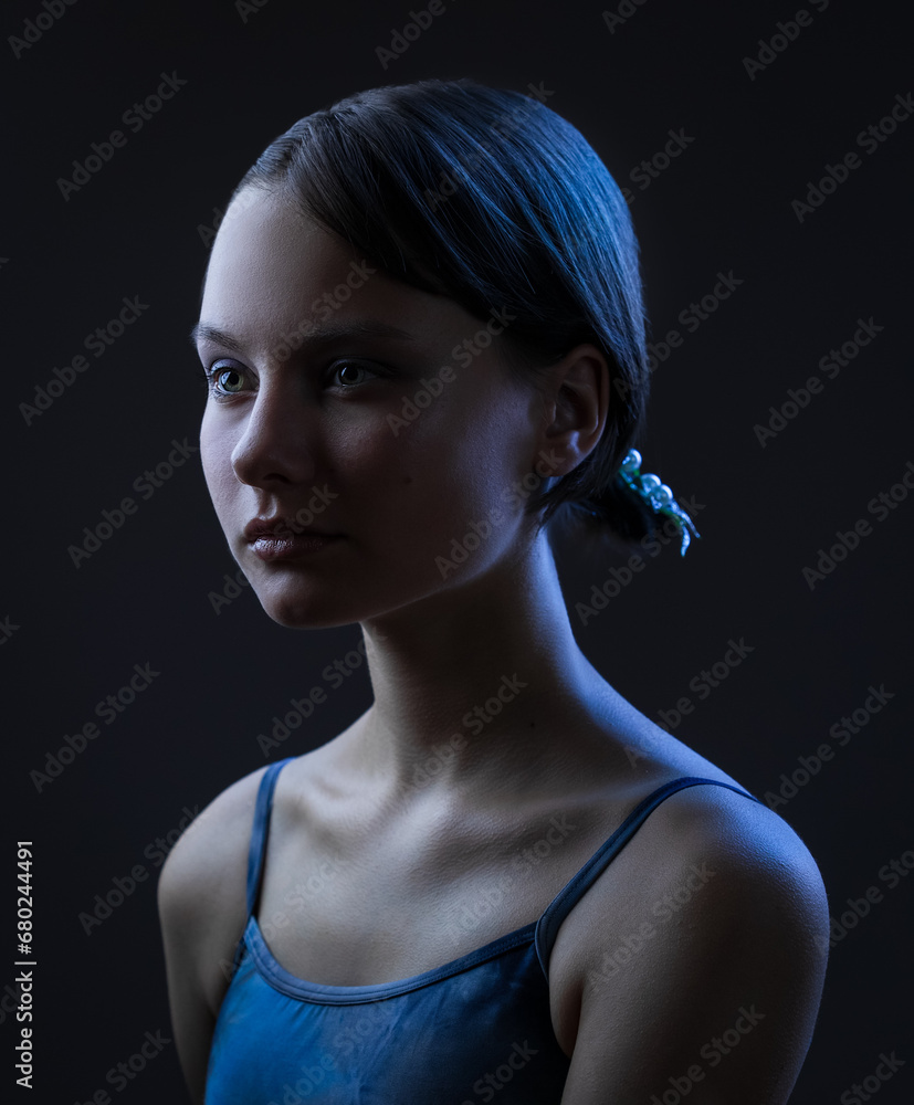 Beauty creative portrait of beautiful teen girl against black background