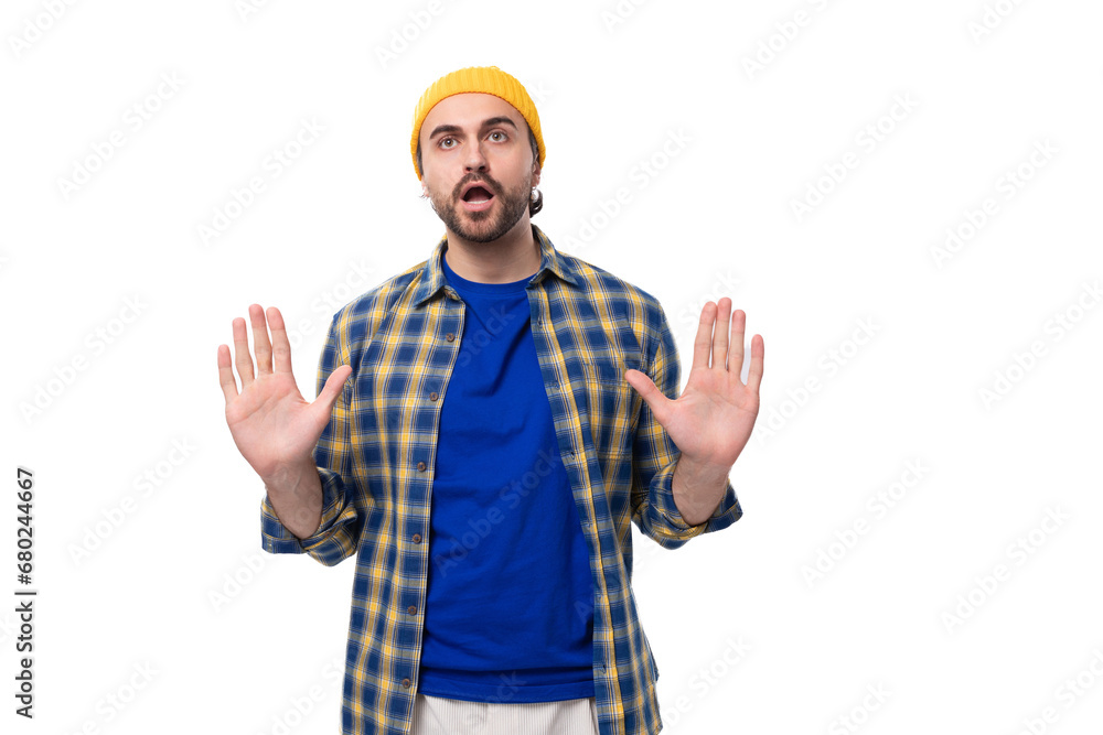 young attractive caucasian brunette handsome guy with a well-groomed beard and mustache in a plaid shirt young attractive caucasian brunette handsome guy with a well-groomed beard and mustache in a plaid shirt