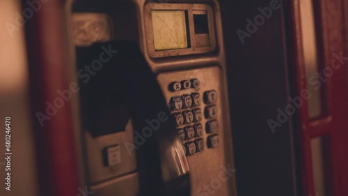 Public payphone in street at night
