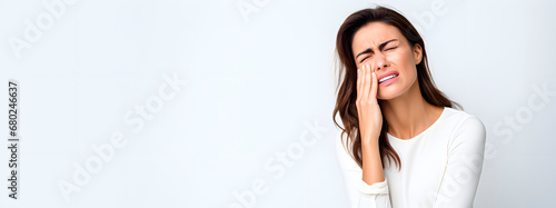 A woman with a toothache expression. Oral hygiene. Inflammation photo