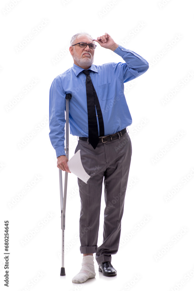Old businessman with crutches isolated on white Old businessman with crutches isolated on white