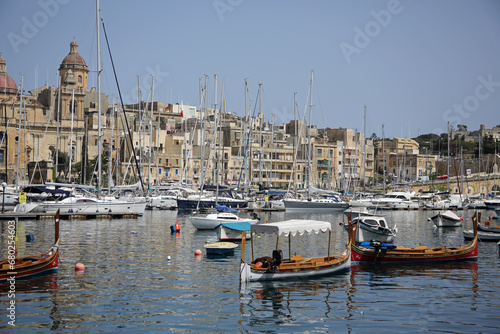 Yachts and old buildings in Valletta , Malta