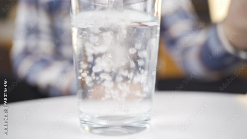Close-up of a glass of water, its bubbles. Close-up of a glass of water, its bubbles.
