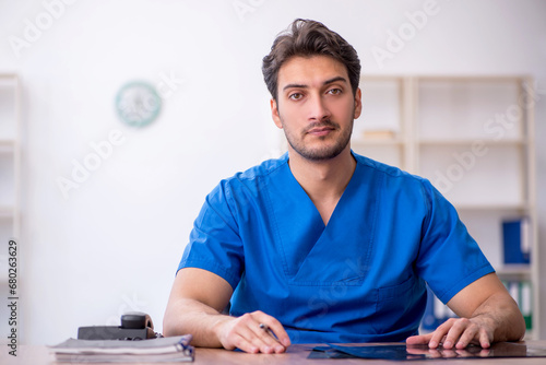 Young male doctor working in the clinic