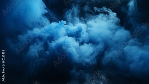 Abstract blue smoke on the black background. Blue mist on the ground. Fog backdrop.