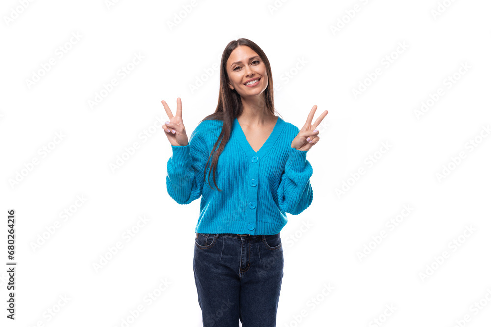 positive young brunette woman dressed in a blue cardigan with buttons positive young brunette woman dressed in a blue cardigan with buttons