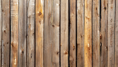 full frame texture background of a wooden fence with natural wood grain planks in bright sunlight