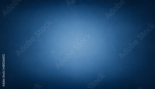 blue flat color paper sheet with light accent in the middle vignetted background