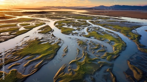 California Wetlands Restoration at Sears Point. Aerial View of Low Tide Marsh Restoration with Sunset Over the Calm Waters