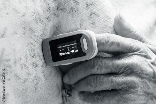 pulse oximeter on finger. Black and white concept. 