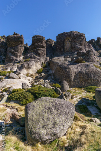 Path with stairs to sculpture of Saint Maria Senhora da Boa Estrela carved into the granite rock, Serra da Estrela, Portugal