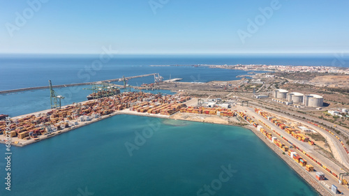 Aerial view of container cargo terminal of commercial port, business logistics and transport industry in Sines Setubal, Portugal. © sergojpg