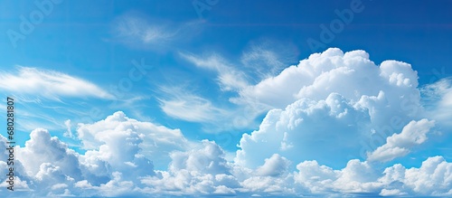 background, the sky exhibited the marvels of nature a splendid canvas of light and white clouds, enhancing the beauty of the blue expanse on a beautiful, bright and cloudy day, as the air felt