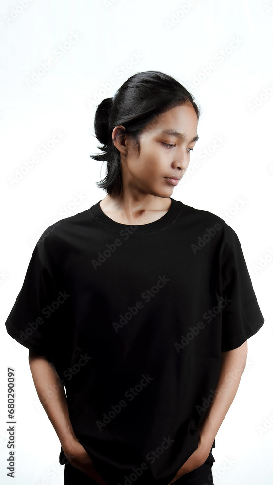 Clothing model. Young Asian man with long curly hair close up shot isolated on white. Asian young man wearing plain black t-shirt isolated on white background. As if he were modeling a plain t-shirt. Clothing model. Young Asian man with long curly hair close up shot isolated on white. Asian young man wearing plain black t-shirt isolated on white background. As if he were modeling a plain t-shirt.