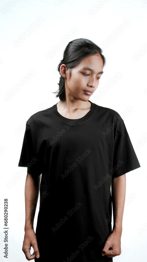 Clothing model. Young Asian man with long curly hair close up shot isolated on white. Asian young man wearing plain black t-shirt isolated on white background. As if he were modeling a plain t-shirt. Clothing model. Young Asian man with long curly hair close up shot isolated on white. Asian young man wearing plain black t-shirt isolated on white background. As if he were modeling a plain t-shirt.