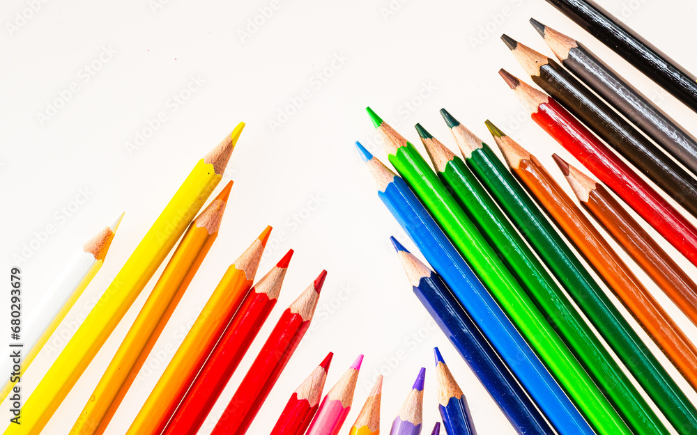 A Vibrant Spectrum of Colored Pencils in a Harmonious Arrangement. A group of colored pencils sitting next to each other A Vibrant Spectrum of Colored Pencils in a Harmonious Arrangement. A group of colored pencils sitting next to each other