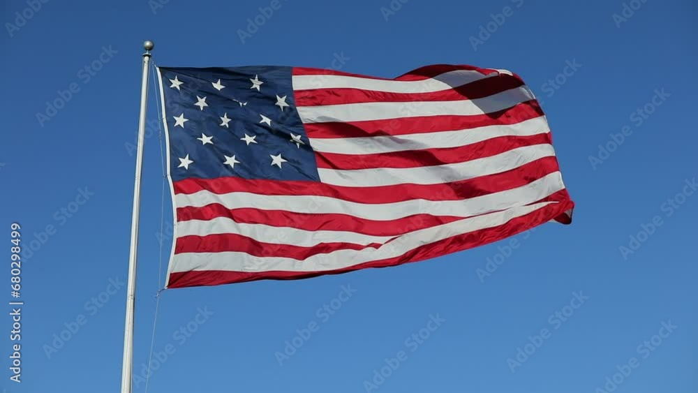 Waving USA Flag in Clear Blue Sky. USA American Flag. Waving United States of America Famous Flag Waving USA Flag in Clear Blue Sky. USA American Flag. Waving United States of America Famous Flag