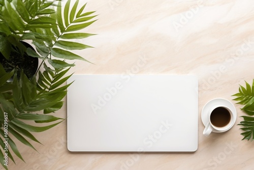 Elegant workspace: Top view of desk with keyboard, tablet, coffee, plants on marble, with space for text.