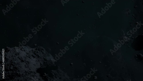 Asteroid belt field in dark outer space. 3D animation wide pan shot. Rock formations of cosmic debris and giant Meteorites. Celestial objects on starry stars background with dust nebula haze low light photo