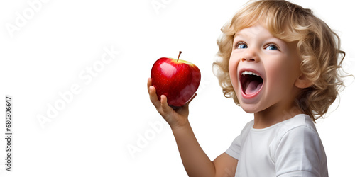 A child holds an apple to eat