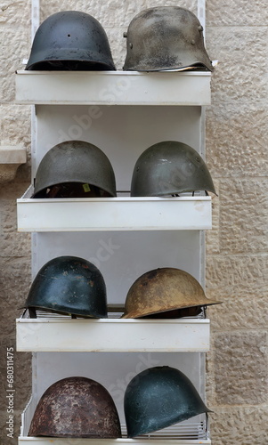 Old helmets from the World War II displayed for sale in a market stall of the Old Bazaar-Pazari i Vjeter. Kruje-Albania-056