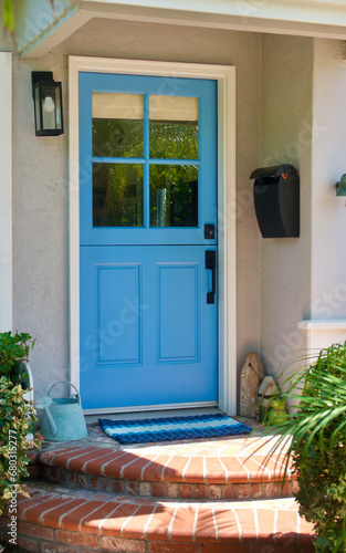 bright blue door to a cute beach cottage