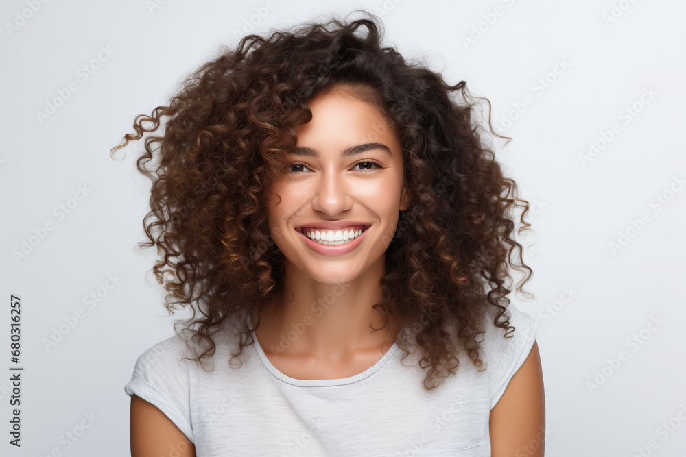 Beautiful girl with latin features smiling, isolated on white background Beautiful girl with latin features smiling, isolated on white background