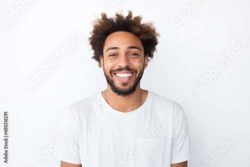 smiling young afro looking frontal portrait. It is on neutral background isolated