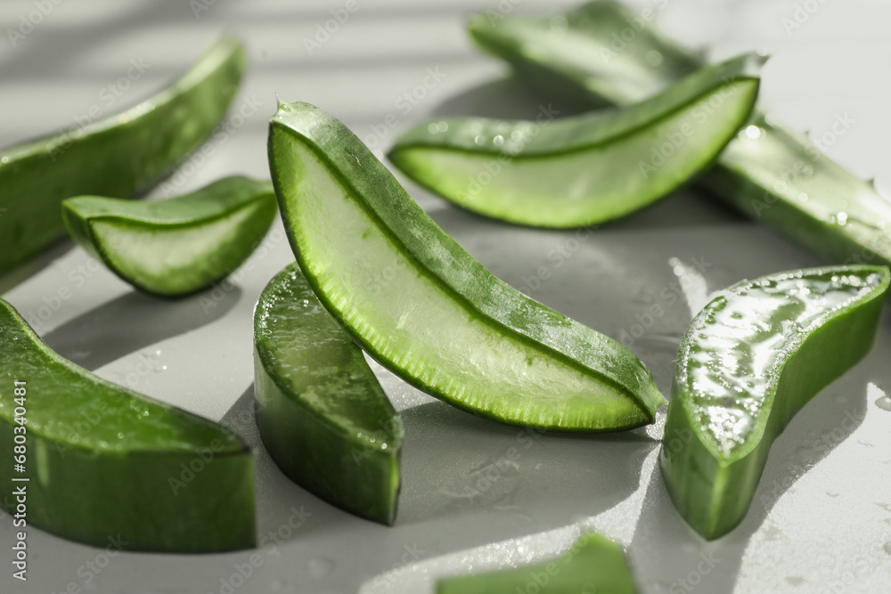 Fresh aloe vera pieces on white table, closeup Fresh aloe vera pieces on white table, closeup