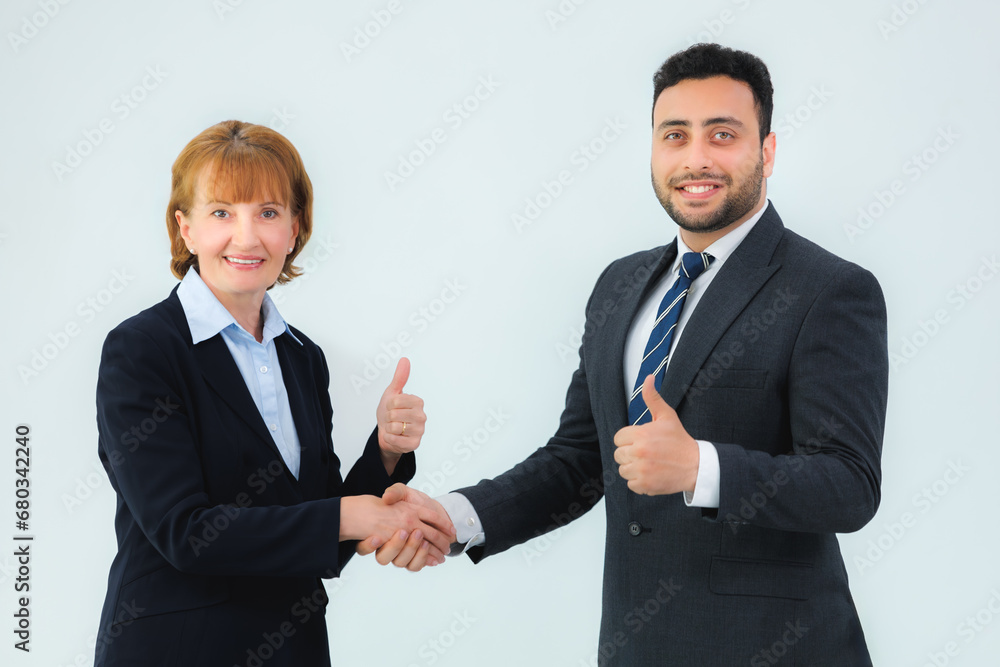 business man and business woman shaking hands in the office business man and business woman shaking hands in the office