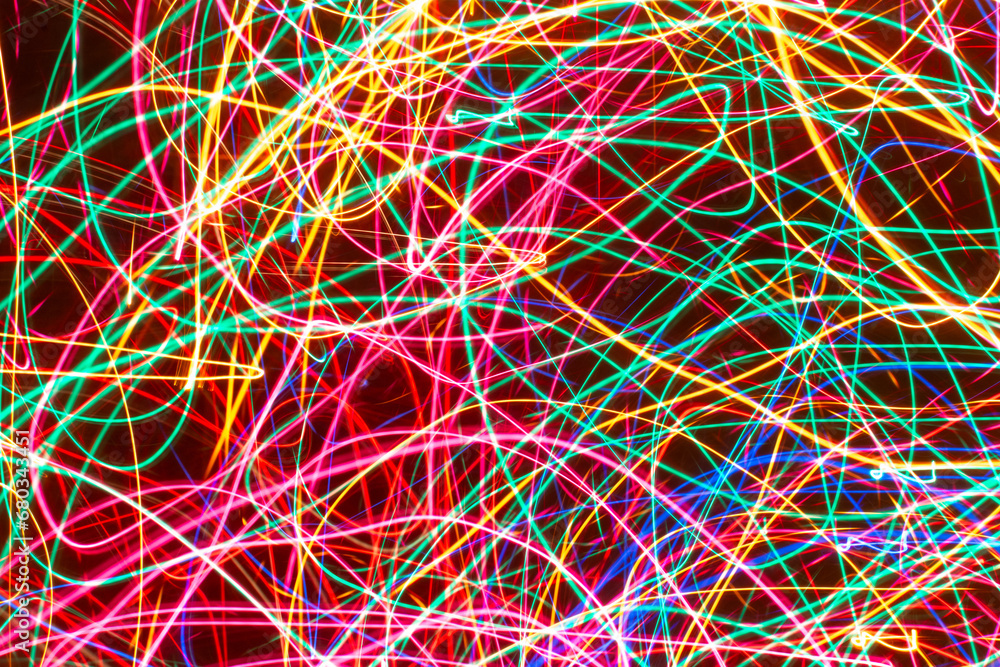 neon abstract light painting of Christmas lights with lines and circles.