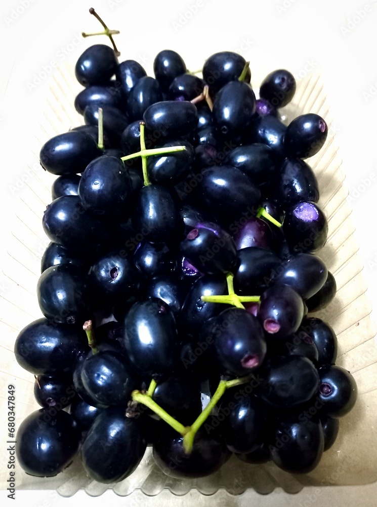 Jambolan plum or Java plum or Duwet fruit or Juwet fruit has sweet astringent taste, usually eaten with salt Jambolan plum or Java plum or Duwet fruit or Juwet fruit has sweet astringent taste, usually eaten with salt