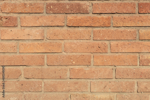 Orange color brick wall front view shot. Brick texture horizontal background.