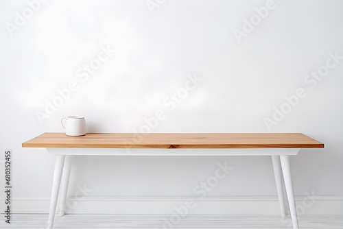 Wooden table against a white wall for display purposes. High Quality Photo. © Sarah