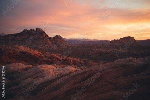 A stunning view of layered canyon formations at sunset, with the warm glow of the setting sun casting a beautiful light over the rugged landscape. 