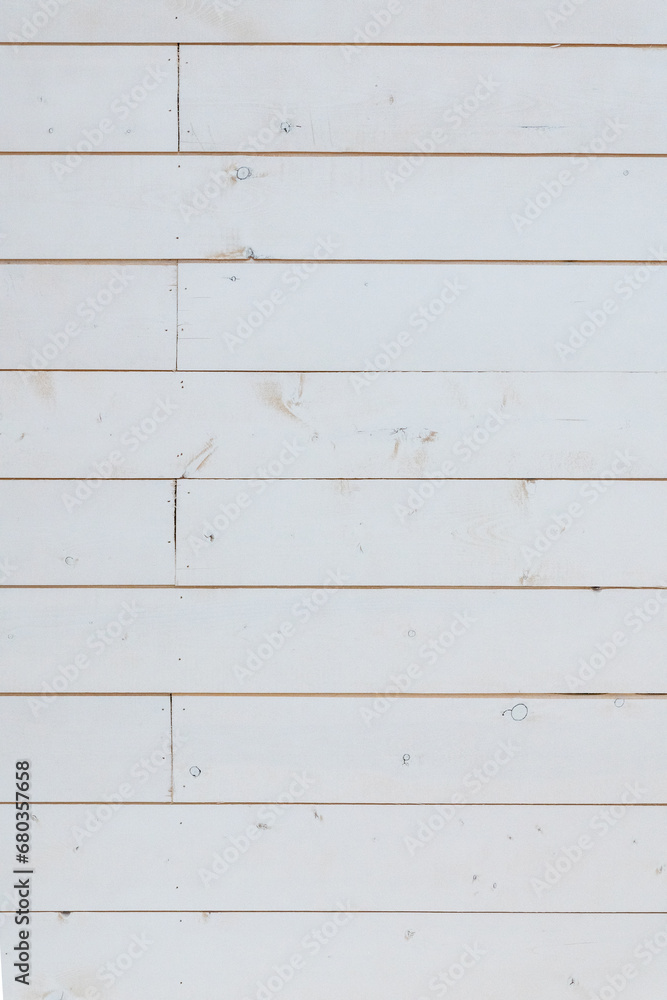 White painted wood boards with a smooth texture and a rustic, weathered look. White painted wood boards with a smooth texture and a rustic, weathered look.