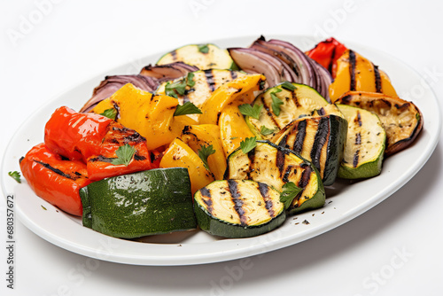 Assortment of grilled vegetables on a white plate. Selective focus