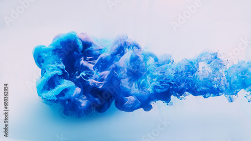 Ink water background. Hypnotic cloud. Bright blue beautiful explosion smoke puff abstraction spreading in captivating shape isolated on white.